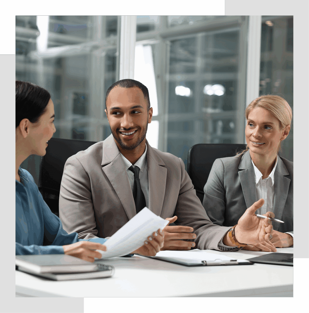 Three professionals in a business meeting.