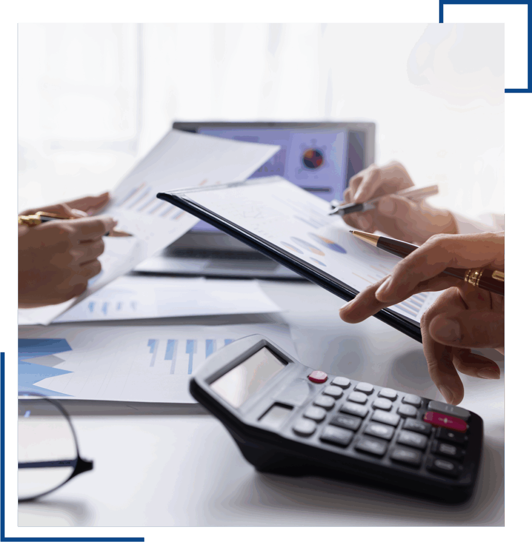 Business meeting with charts and calculator.