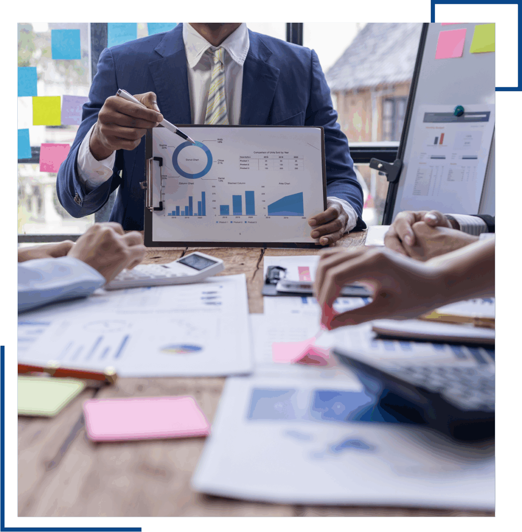 Business meeting with charts and graphs.