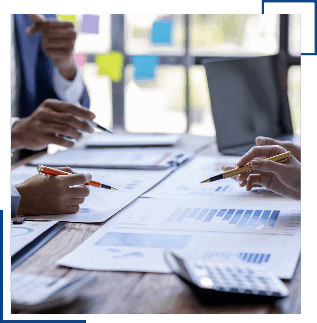 Business meeting with charts and graphs.