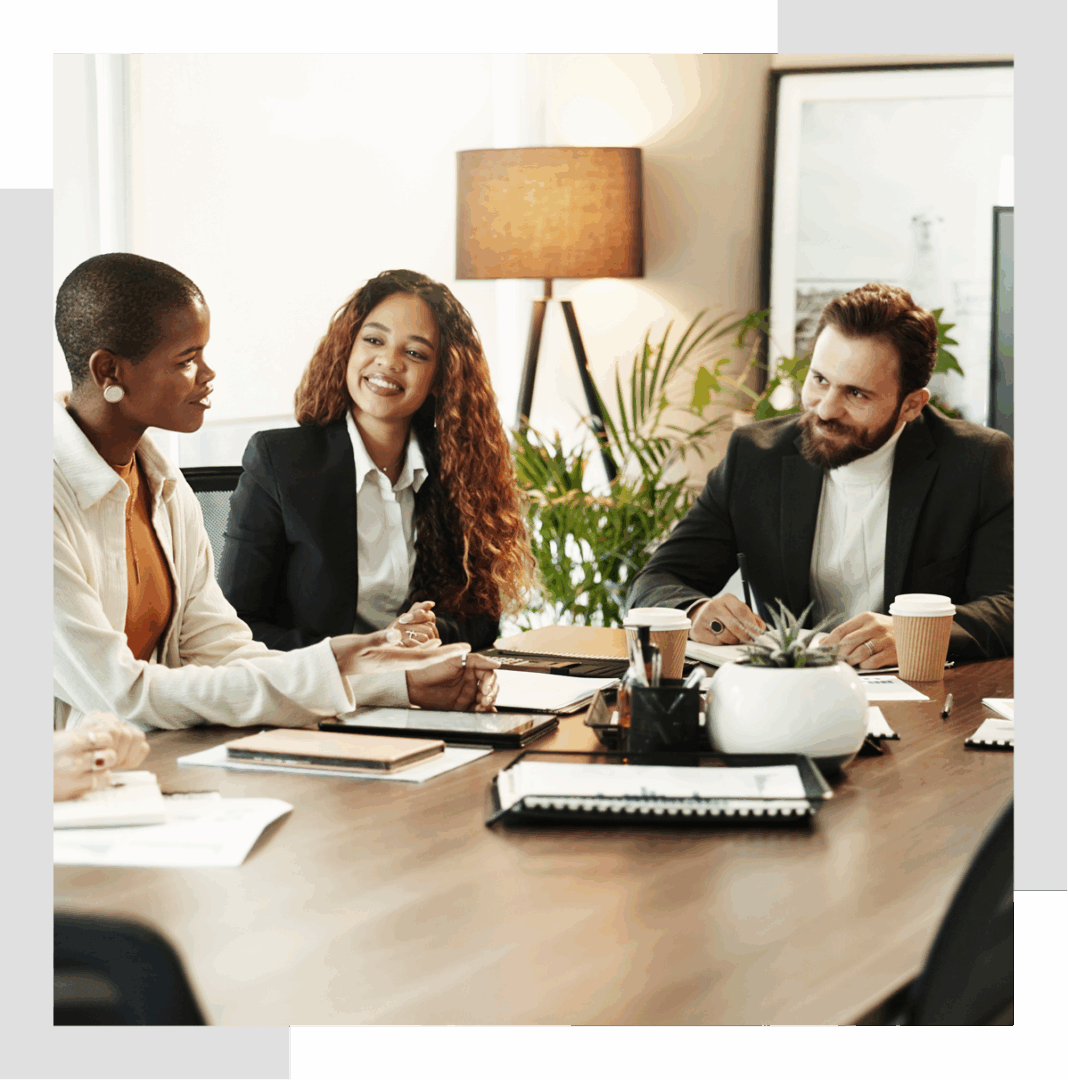 Meeting with three people at a table.